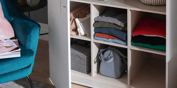 Image a wardrobe with an internal storage unit used for organising clothes and accessories.